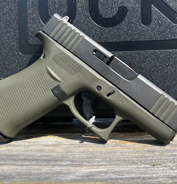 Green colored handguns